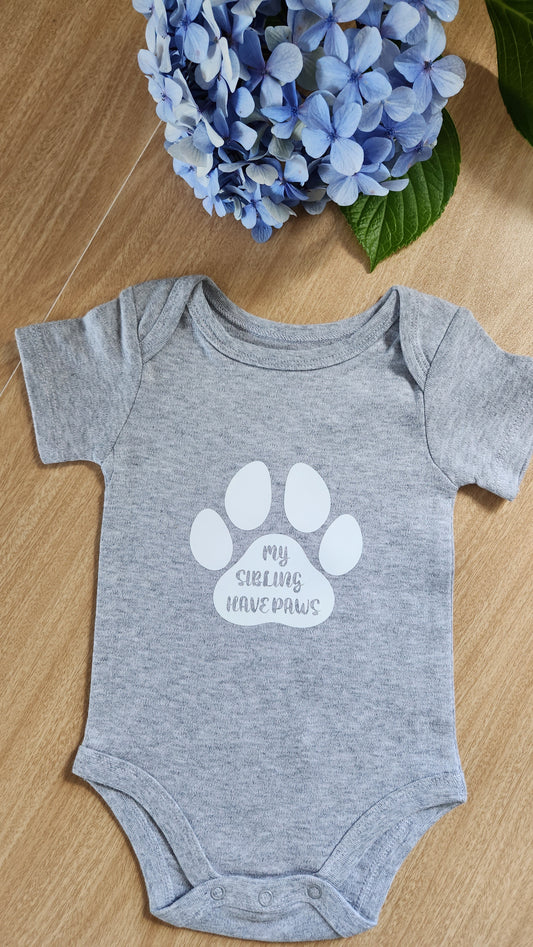 'My siblings have paws' baby onesie (short-sleeve)